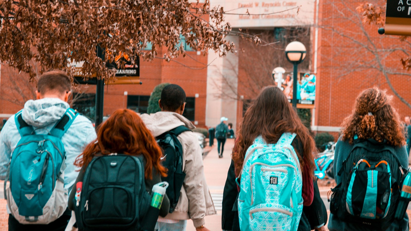 students walking into a building